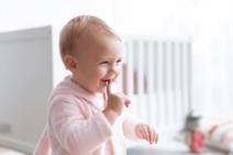 cute-baby-girl-smiling-in-her-nursery-2023-11-27-05-33-29-utc (1)